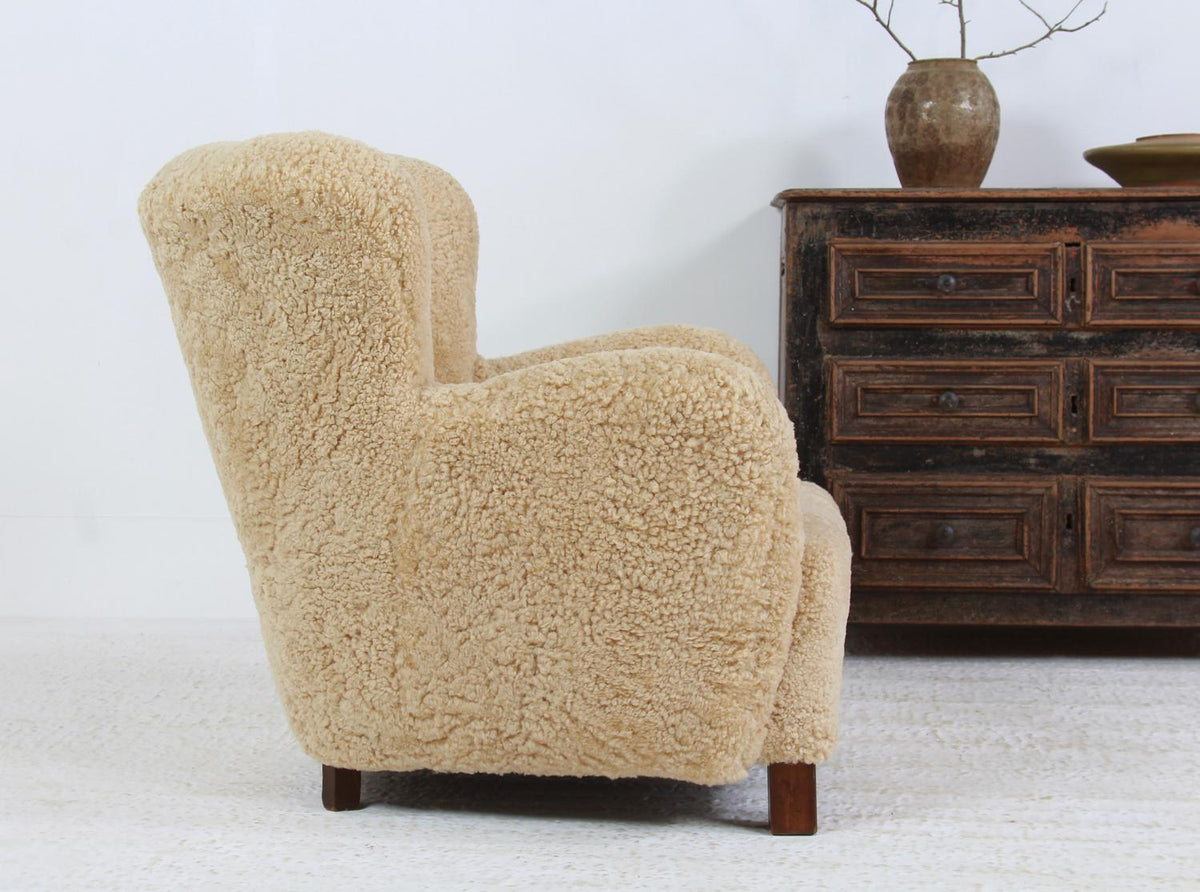 SUMPTUOUS  DANISH CABINET MAKER LOUNGE CHAIR UPHOLSTERED IN HONEY COLOURED SHEEPSKIN