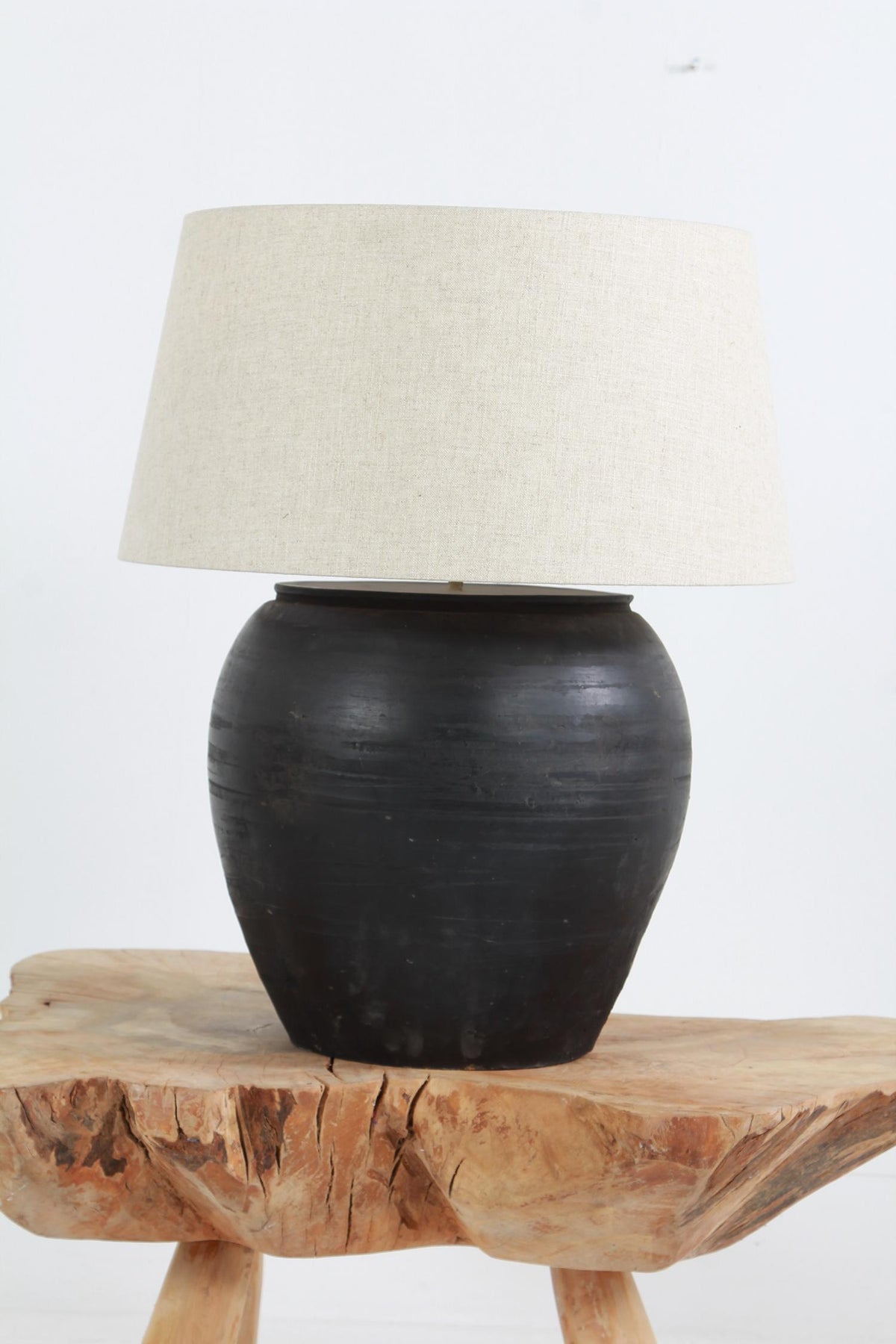 HUGE  ANTIQUE BLACK UNGLAZED POTTERY TABLE LAMP WITH NATURAL DRUM LINEN SHADE
