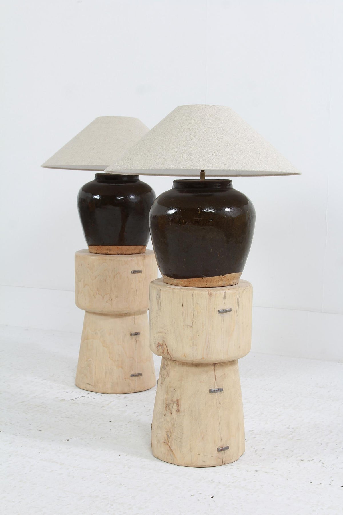 A NEAR PAIR OF UNIQUE ANTIQUE CHINESE STORAGE JAR TABLE LAMPS WITH  LINEN SHADES