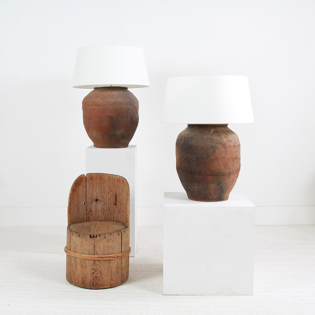 GRAND SCALE CHINESE TEXTURED ANTIQUE TABLE LAMPS WITH OFF WHITE LINEN DRUM SHADES