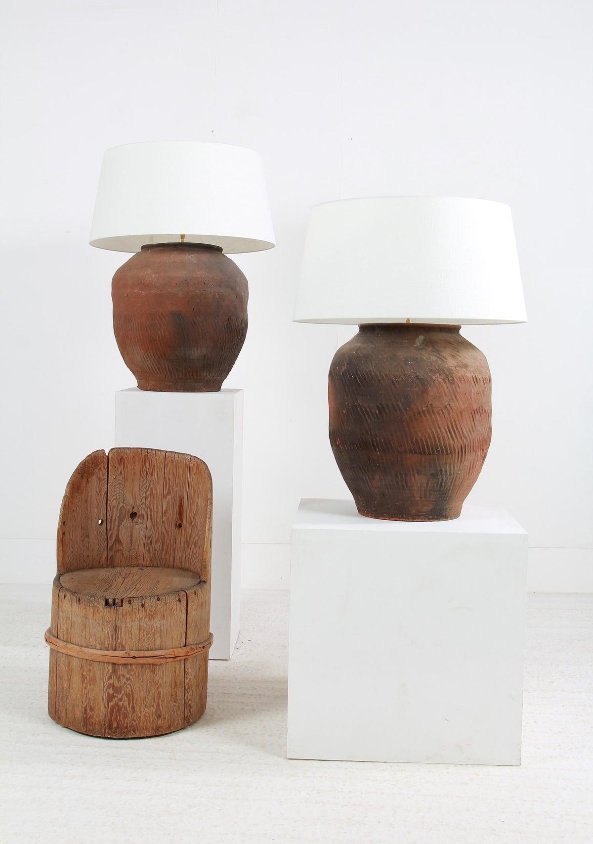 GRAND SCALE CHINESE TEXTURED ANTIQUE TABLE LAMPS WITH OFF WHITE LINEN DRUM SHADES