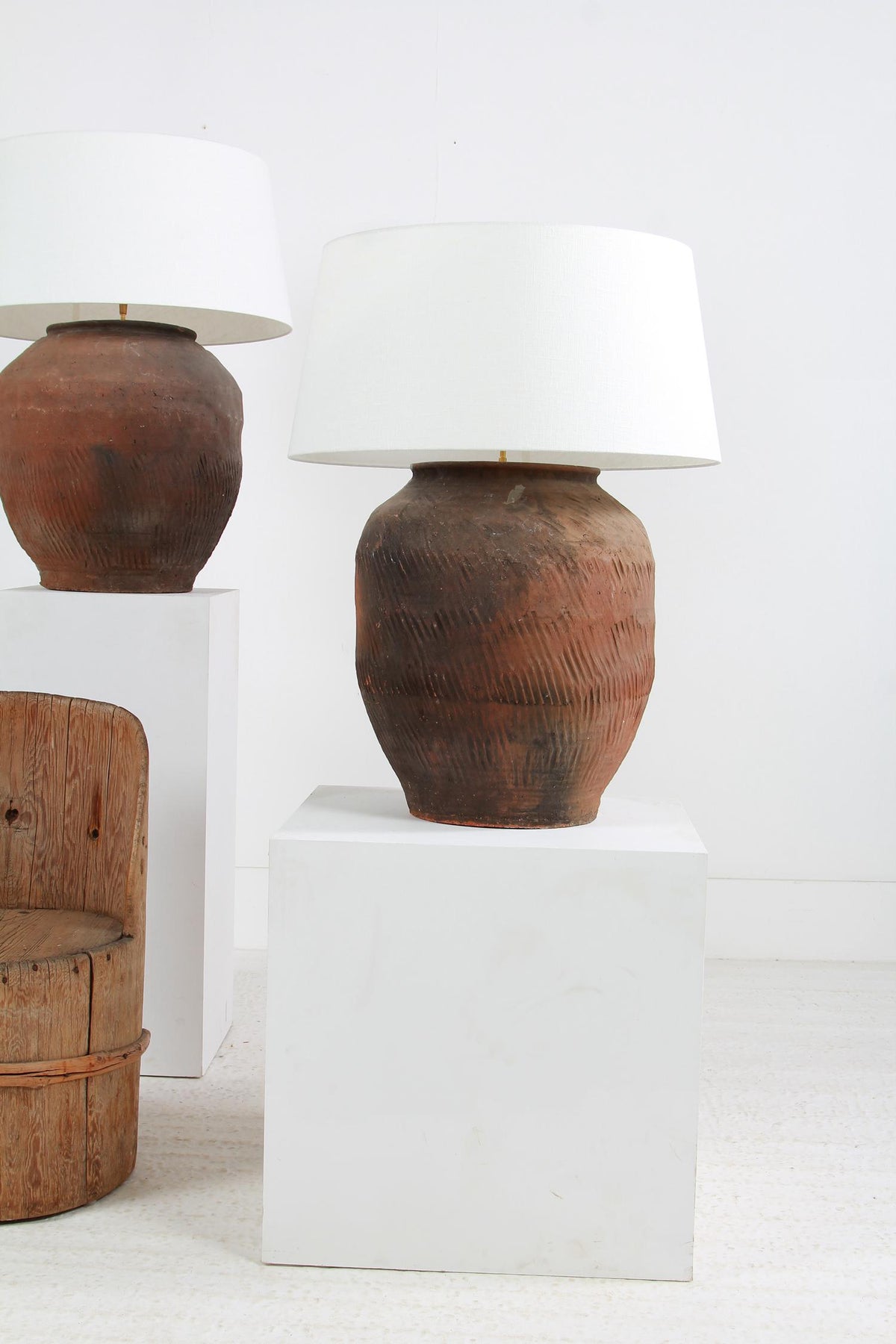 GRAND SCALE CHINESE TEXTURED ANTIQUE TABLE LAMPS WITH OFF WHITE LINEN DRUM SHADES