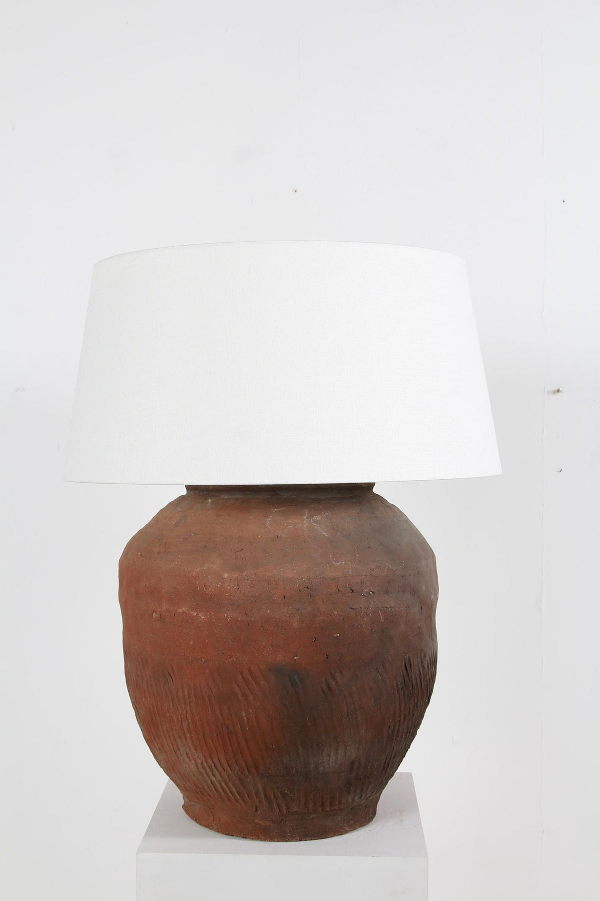 GRAND SCALE CHINESE TEXTURED ANTIQUE TABLE LAMPS WITH OFF WHITE LINEN DRUM SHADES