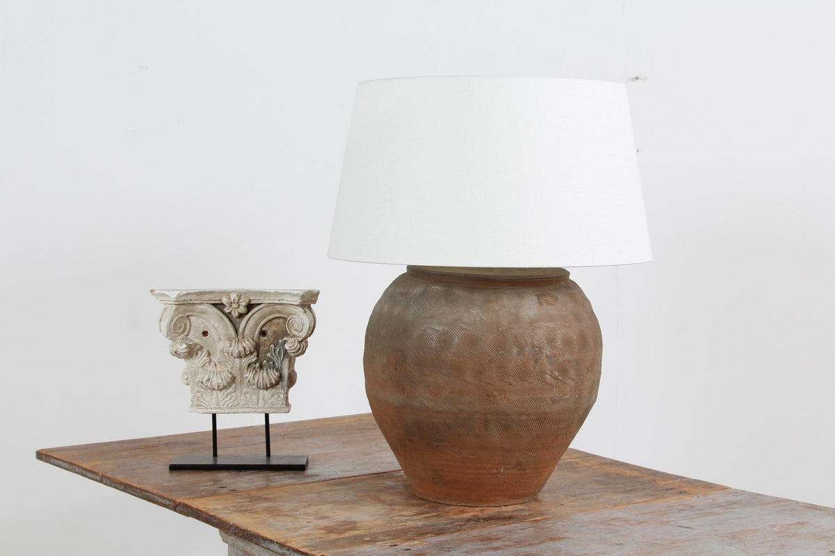 CHINESE TEXTURED ANTIQUE TABLE LAMP WITH OFF WHITE LINEN DRUM SHADE