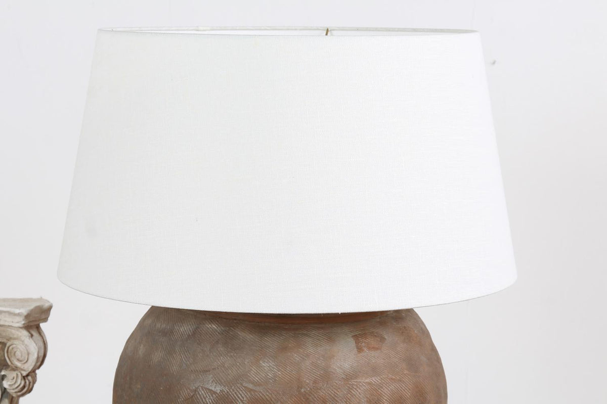 CHINESE TEXTURED ANTIQUE TABLE LAMP WITH OFF WHITE LINEN DRUM SHADE