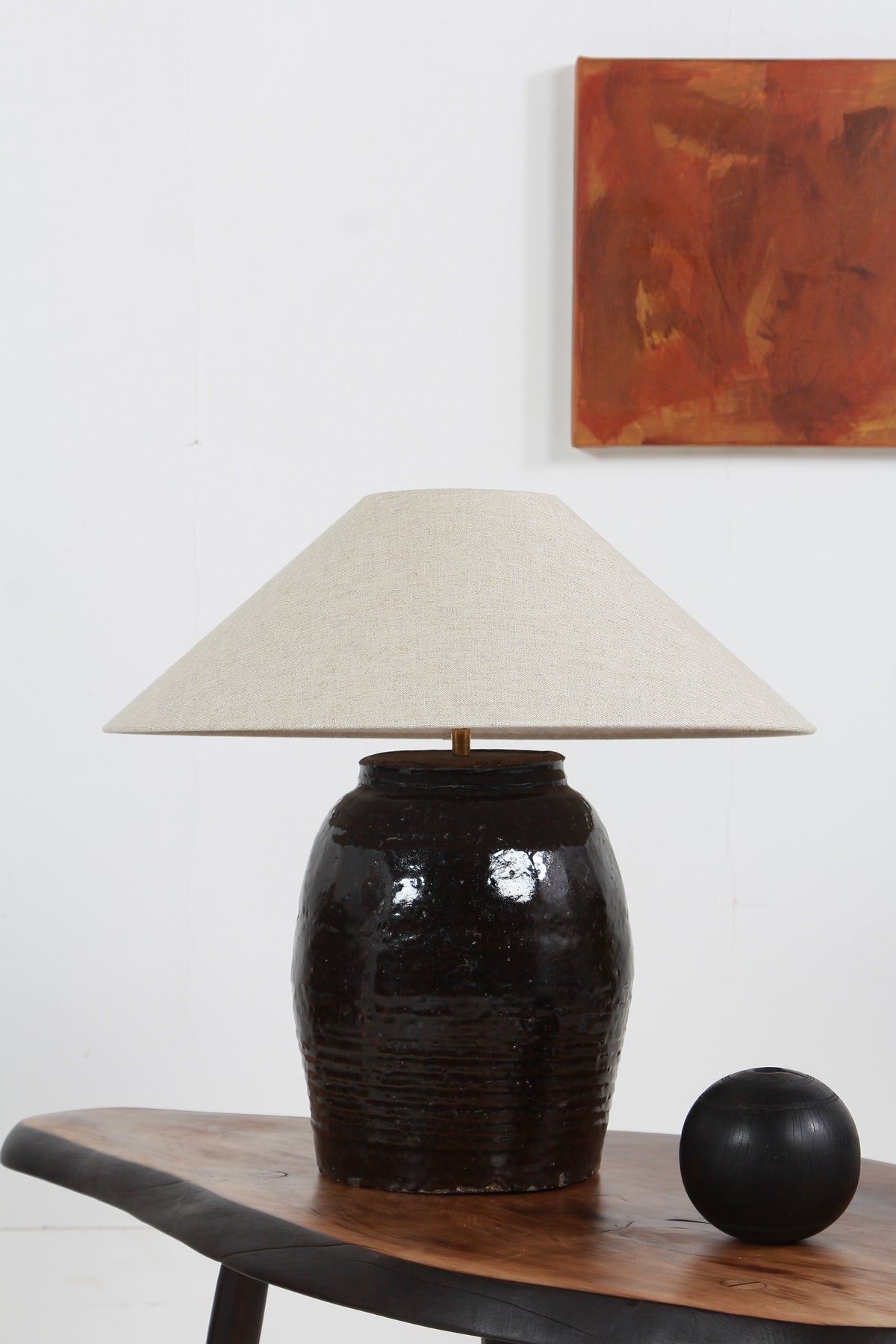 STRIKING ANTIQUE OIL POT LAMP WITH NATURAL BELGIUM LINEN SHADE