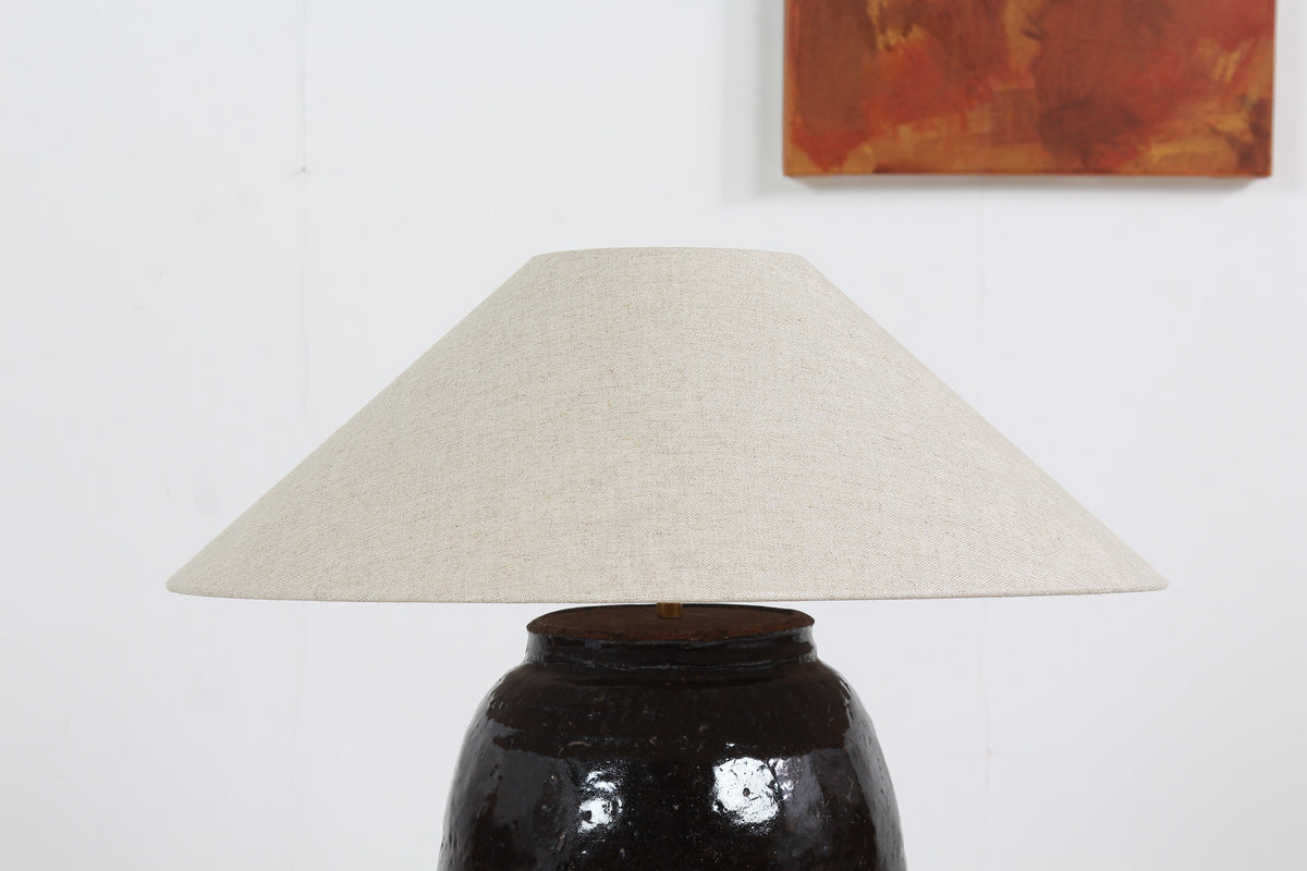 STRIKING ANTIQUE OIL POT LAMP WITH NATURAL BELGIUM LINEN SHADE