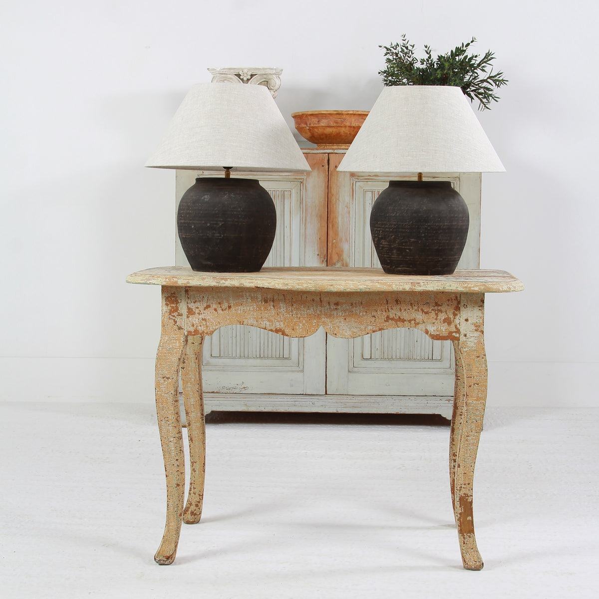 NEAR PAIR OF CHINESE BLACK POTTERY TABLE  LAMPS WITH NATURAL LINEN EMPIRE SHADES