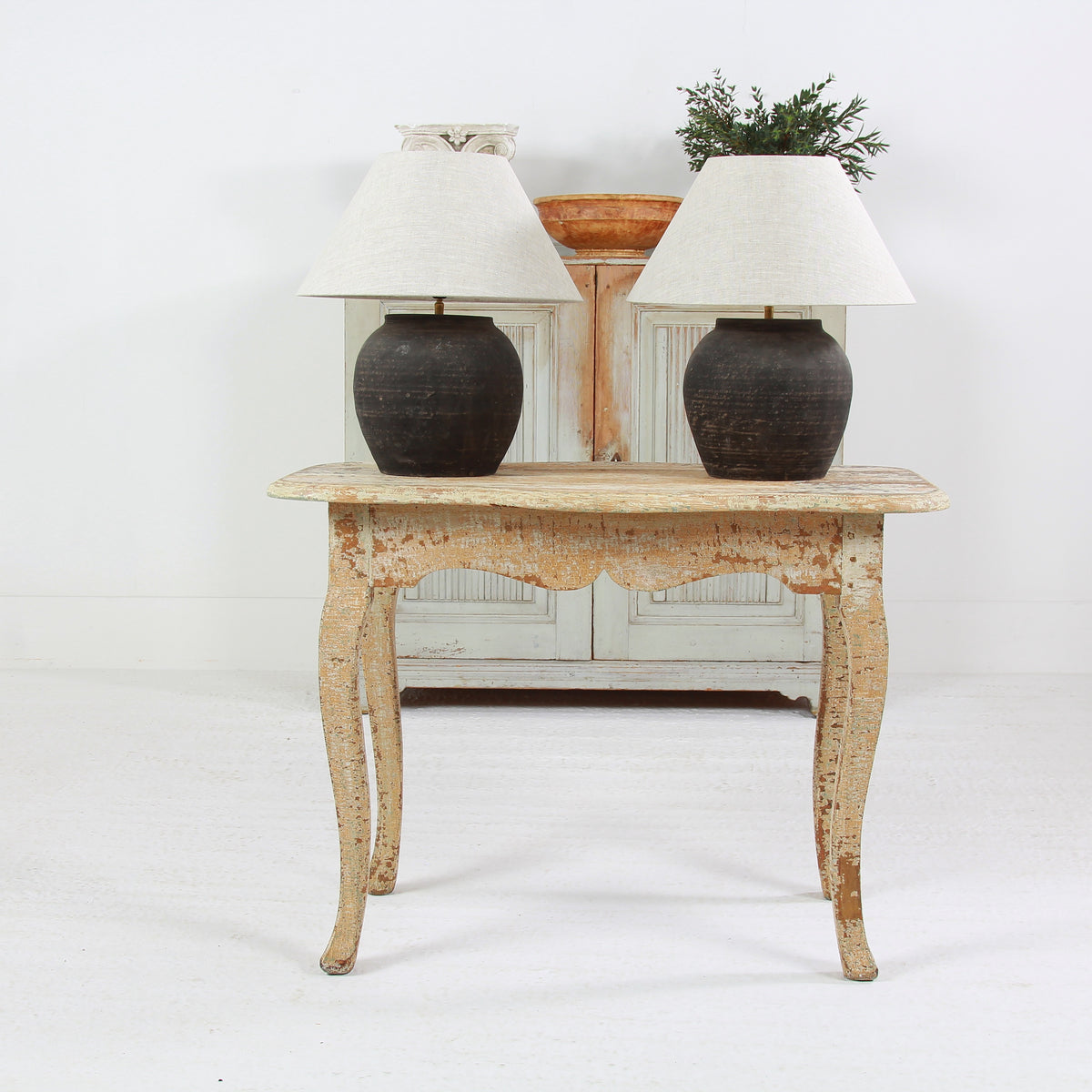 NEAR PAIR OF CHINESE BLACK POTTERY TABLE  LAMPS WITH NATURAL LINEN EMPIRE SHADES