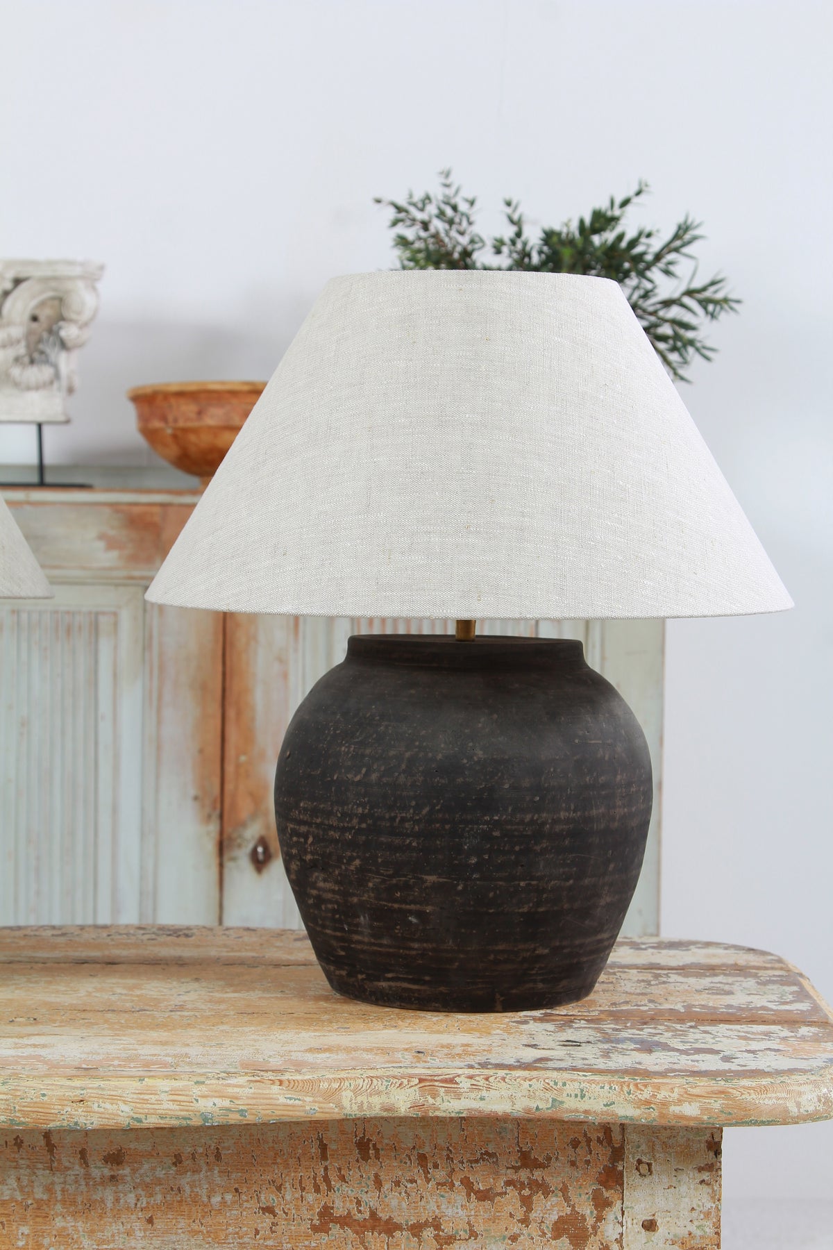 NEAR PAIR OF CHINESE BLACK POTTERY TABLE  LAMPS WITH NATURAL LINEN EMPIRE SHADES