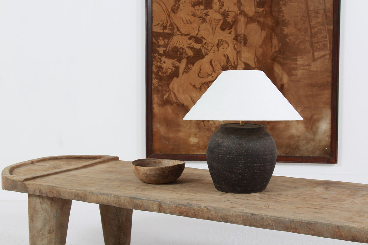 BLACK UNGLAZED POTTERY TABLE LAMP WITH WHITE EMPIRE LINEN SHADE