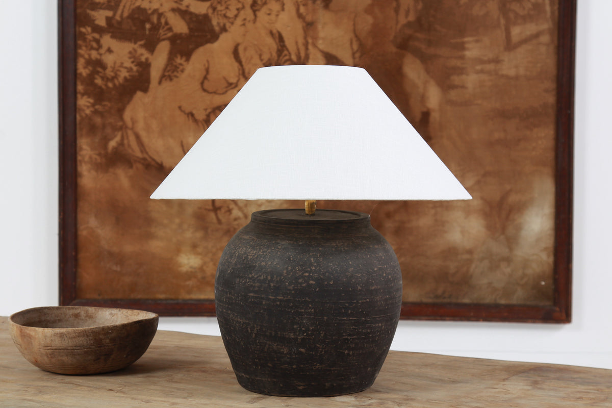 BLACK UNGLAZED POTTERY TABLE LAMP WITH WHITE EMPIRE LINEN SHADE