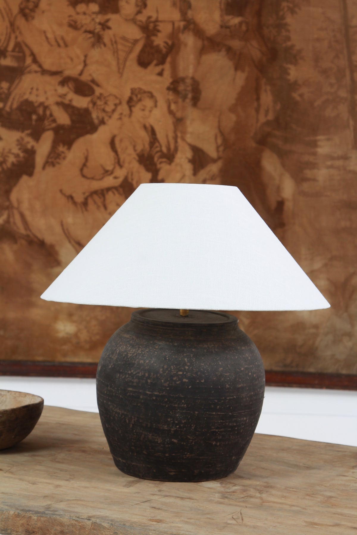 BLACK UNGLAZED POTTERY TABLE LAMP WITH WHITE EMPIRE LINEN SHADE