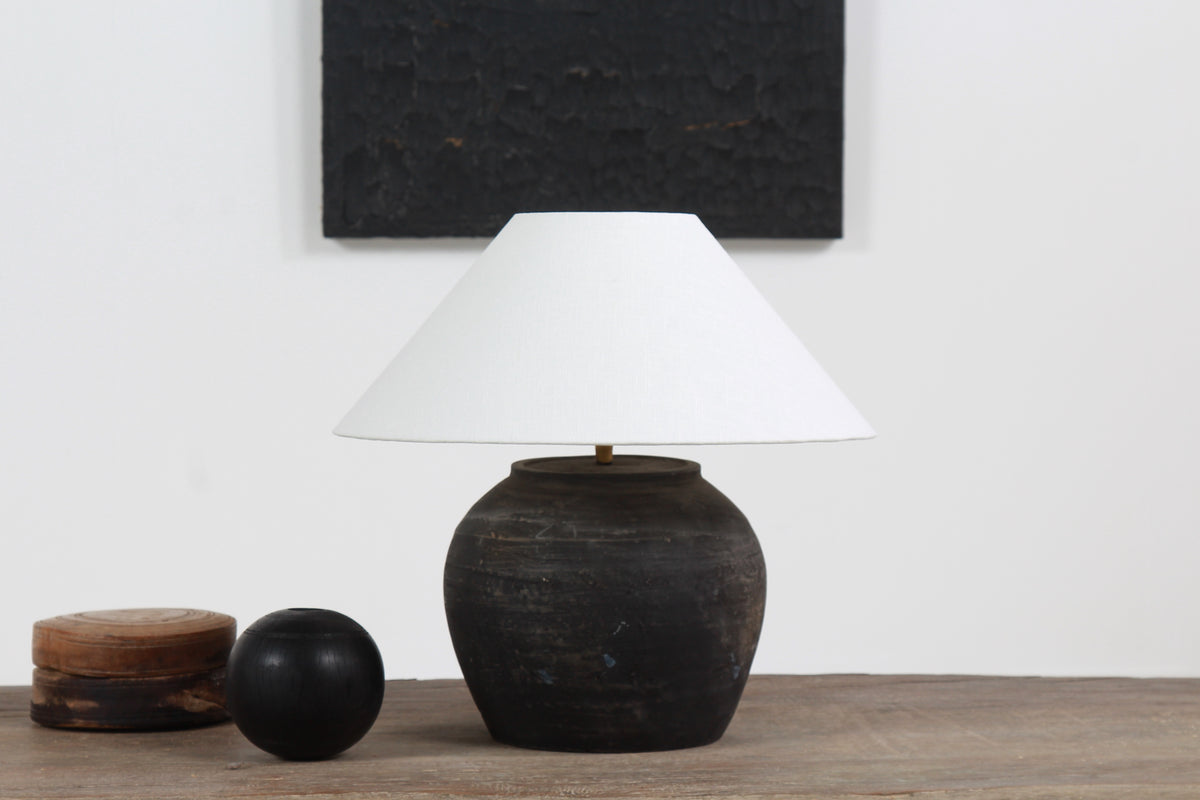 BLACK UNGLAZED POTTERY TABLE LAMP WITH WHITE EMPIRE LINEN SHADE