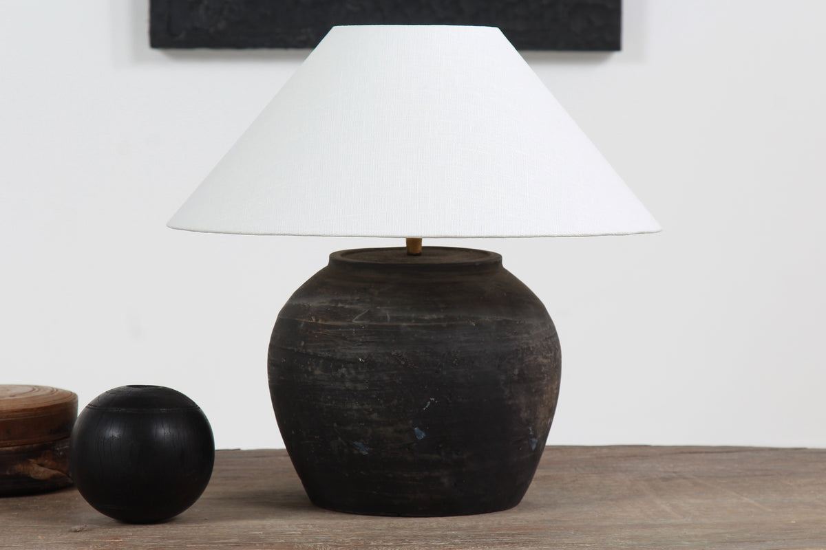 BLACK UNGLAZED POTTERY TABLE LAMP WITH WHITE EMPIRE LINEN SHADE