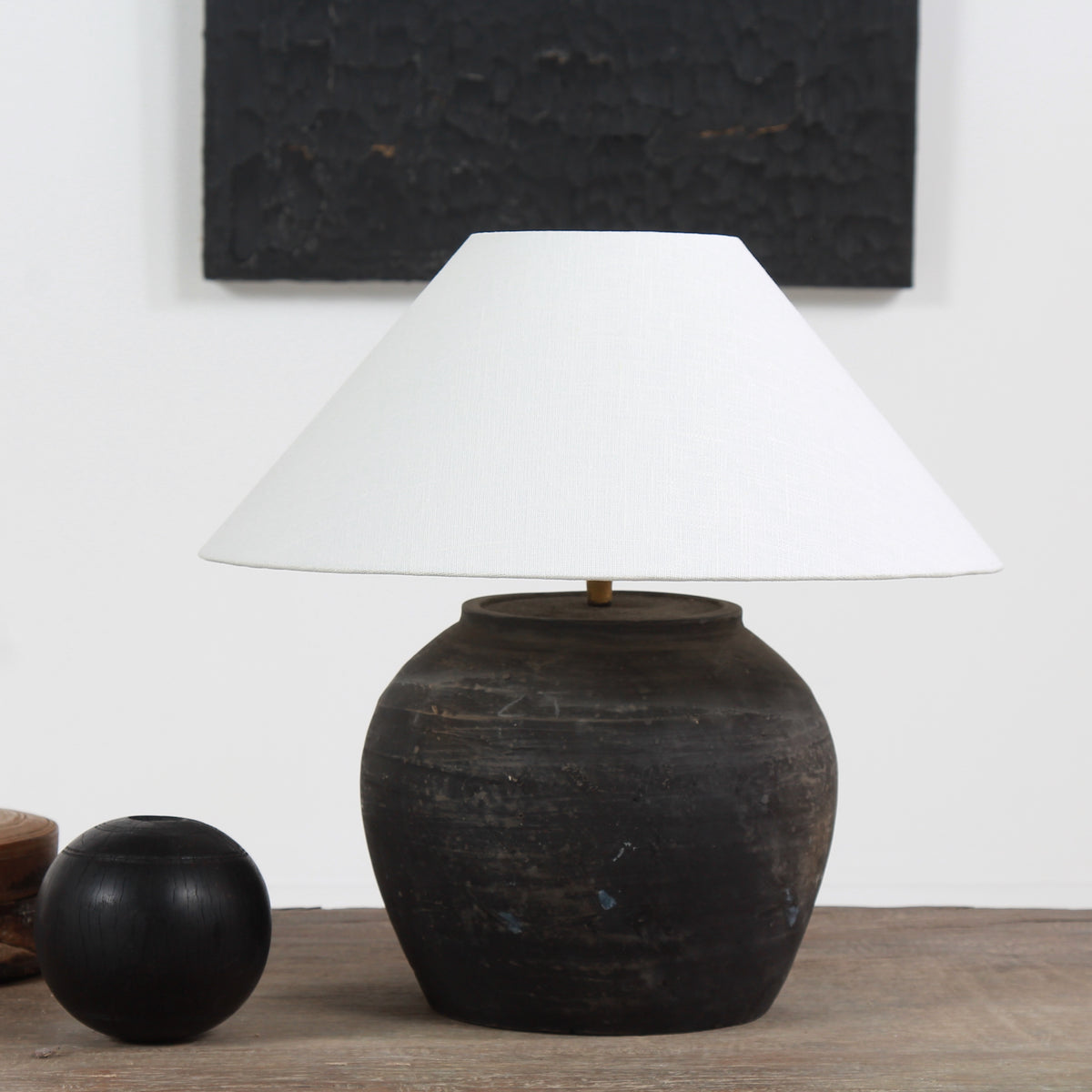 BLACK UNGLAZED POTTERY TABLE LAMP WITH WHITE EMPIRE LINEN SHADE