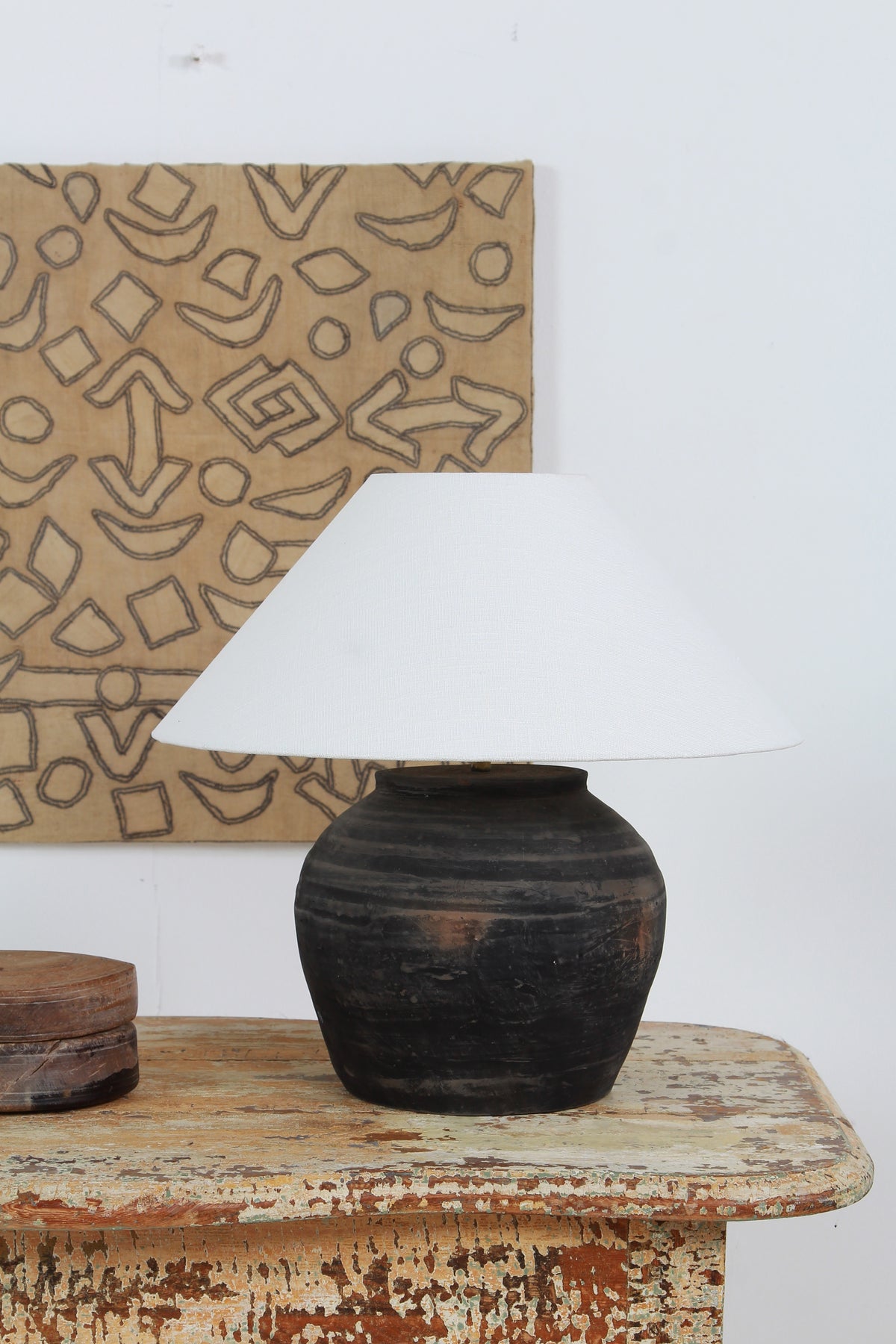 BLACK UNGLAZED POTTERY TABLE LAMP WITH WHITE EMPIRE LINEN SHADE