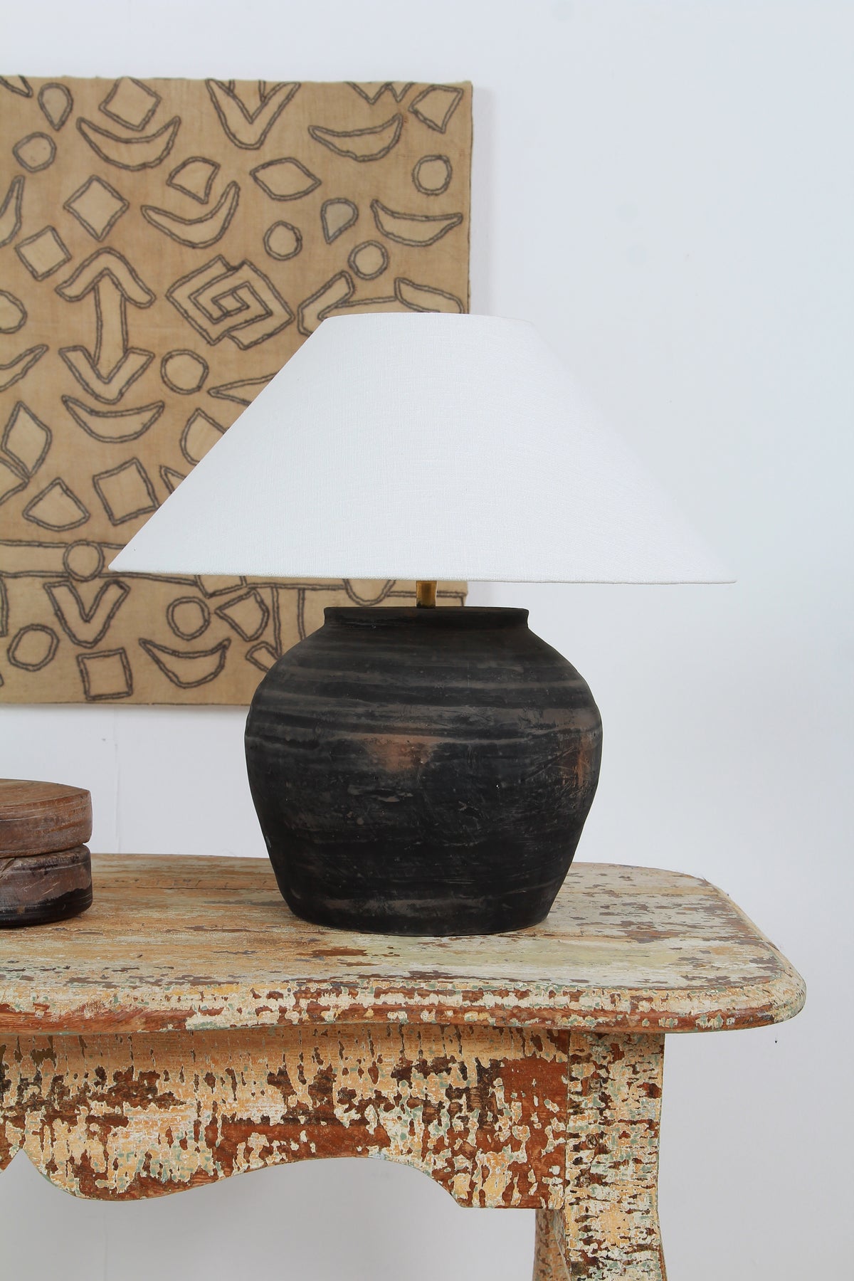 BLACK UNGLAZED POTTERY TABLE LAMP WITH WHITE EMPIRE LINEN SHADE