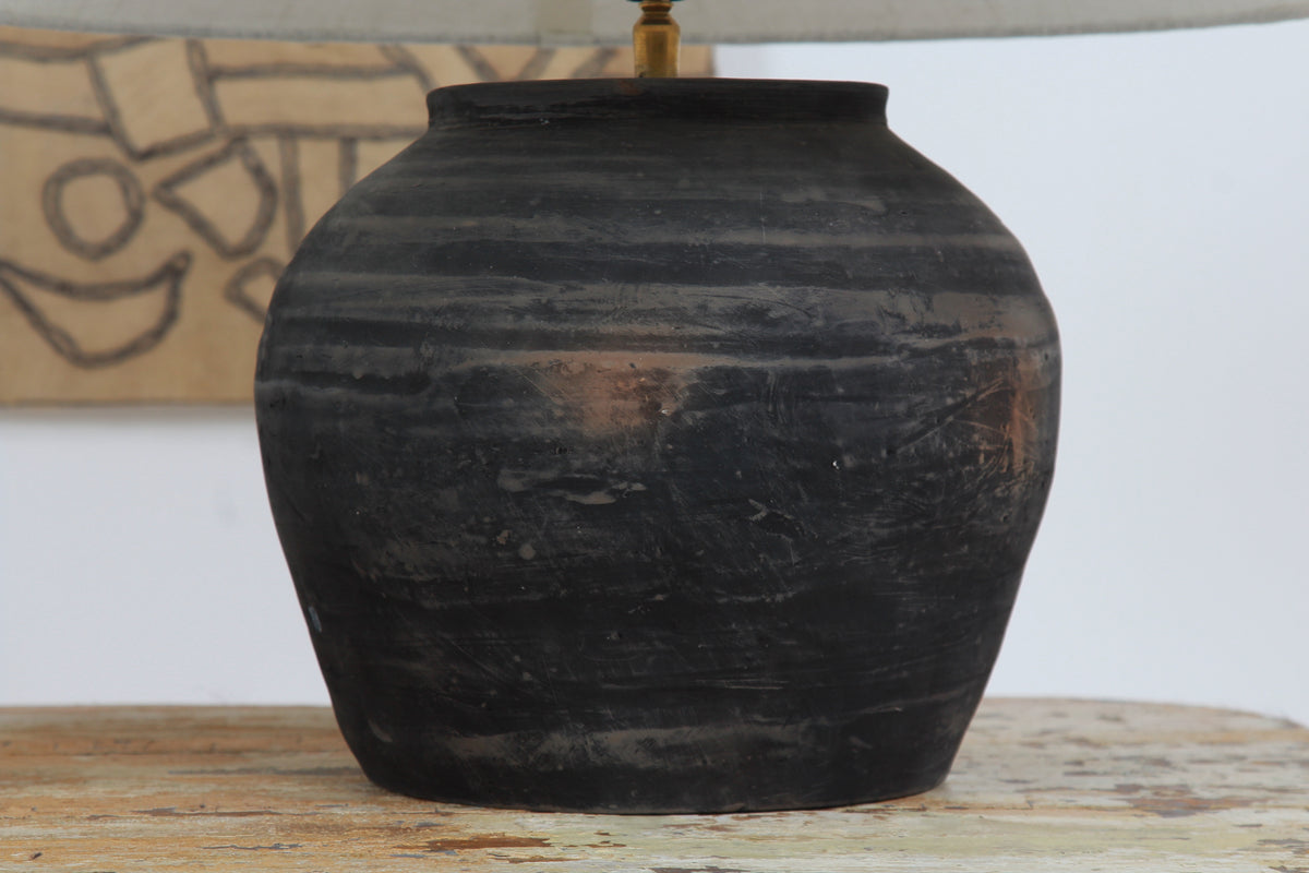 BLACK UNGLAZED POTTERY TABLE LAMP WITH WHITE EMPIRE LINEN SHADE