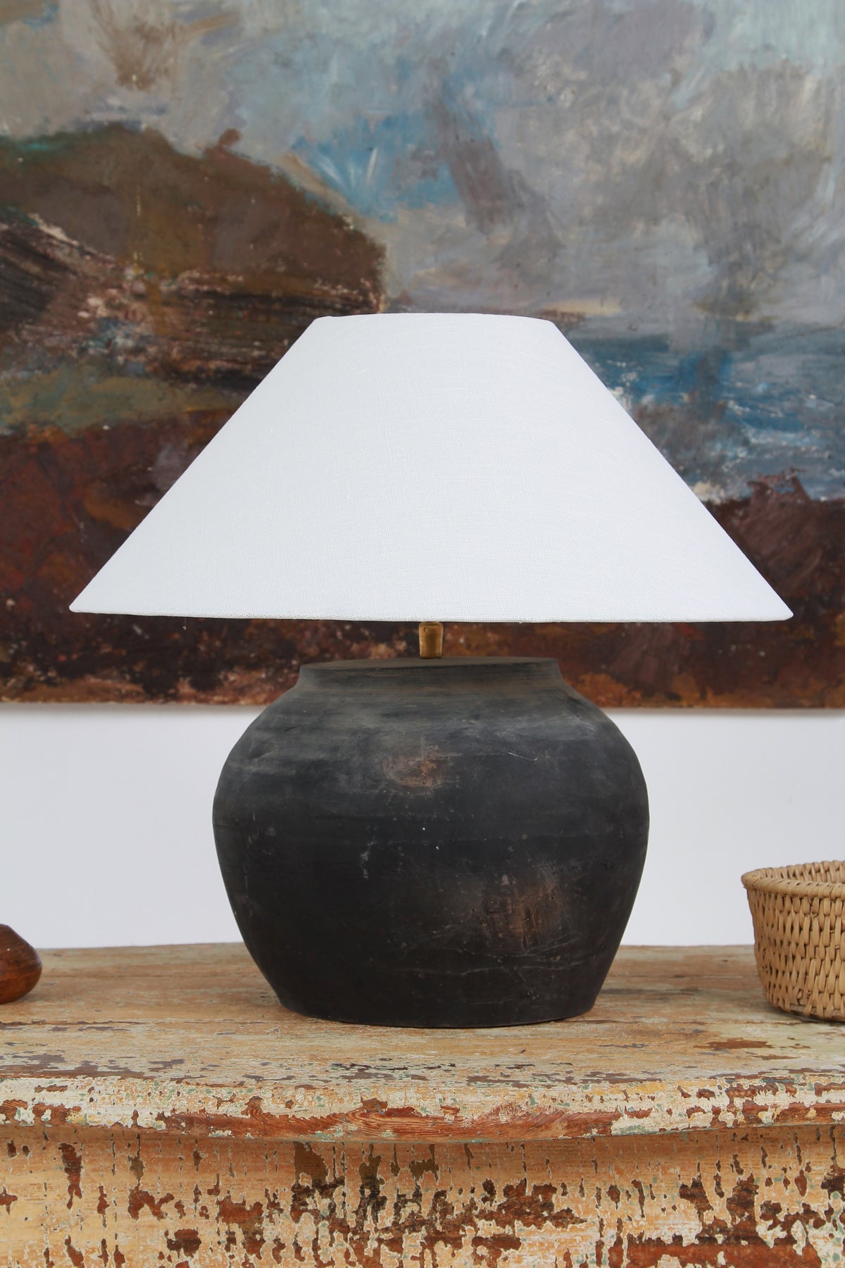 CHINESE BLACK UNGLAZED POTTERY TABLE LAMP WITH WHITE EMPIRE LINEN SHADE