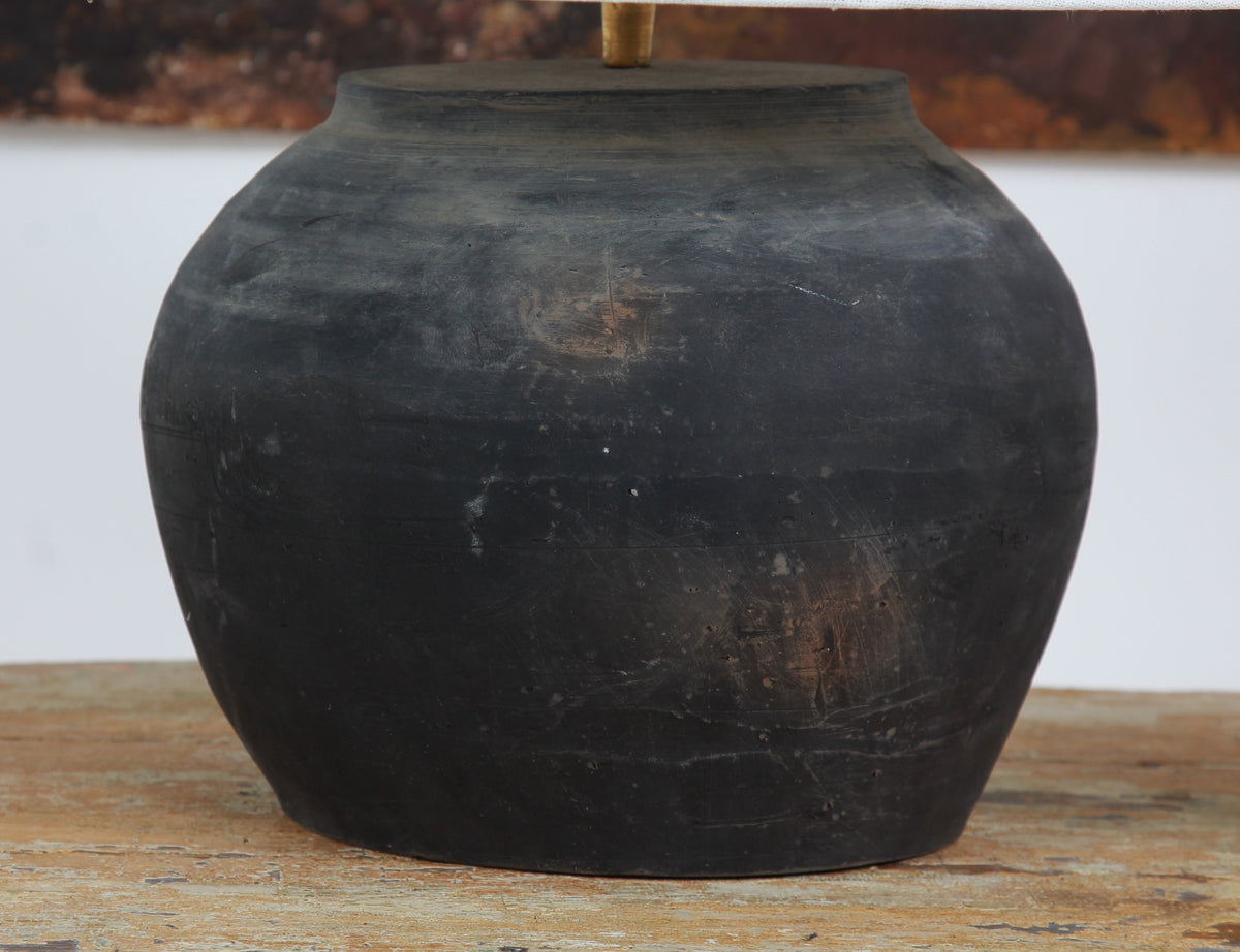 CHINESE BLACK UNGLAZED POTTERY TABLE LAMP WITH WHITE EMPIRE LINEN SHADE