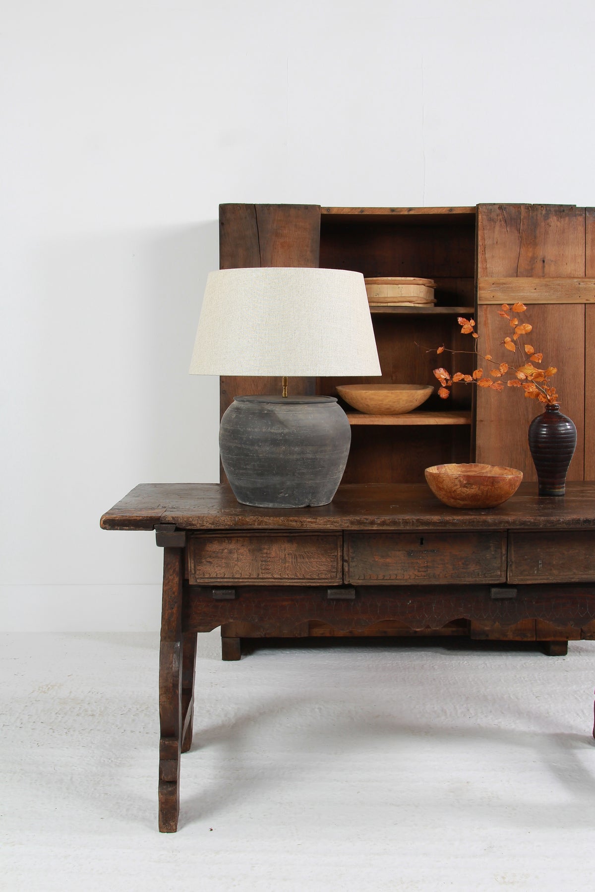 ANTIQUE BLACK UNGLAZED TABLE LAMP WITH NATURAL LINEN DRUM SHADE