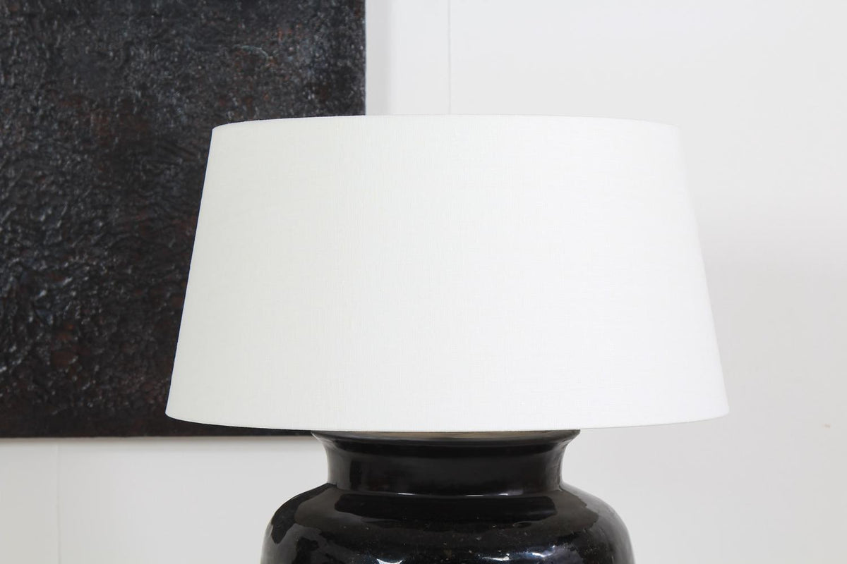 MONUMENTAL ANTIQUE BLACK GLAZED POTTERY LAMP WITH WHITE LINEN SHADE