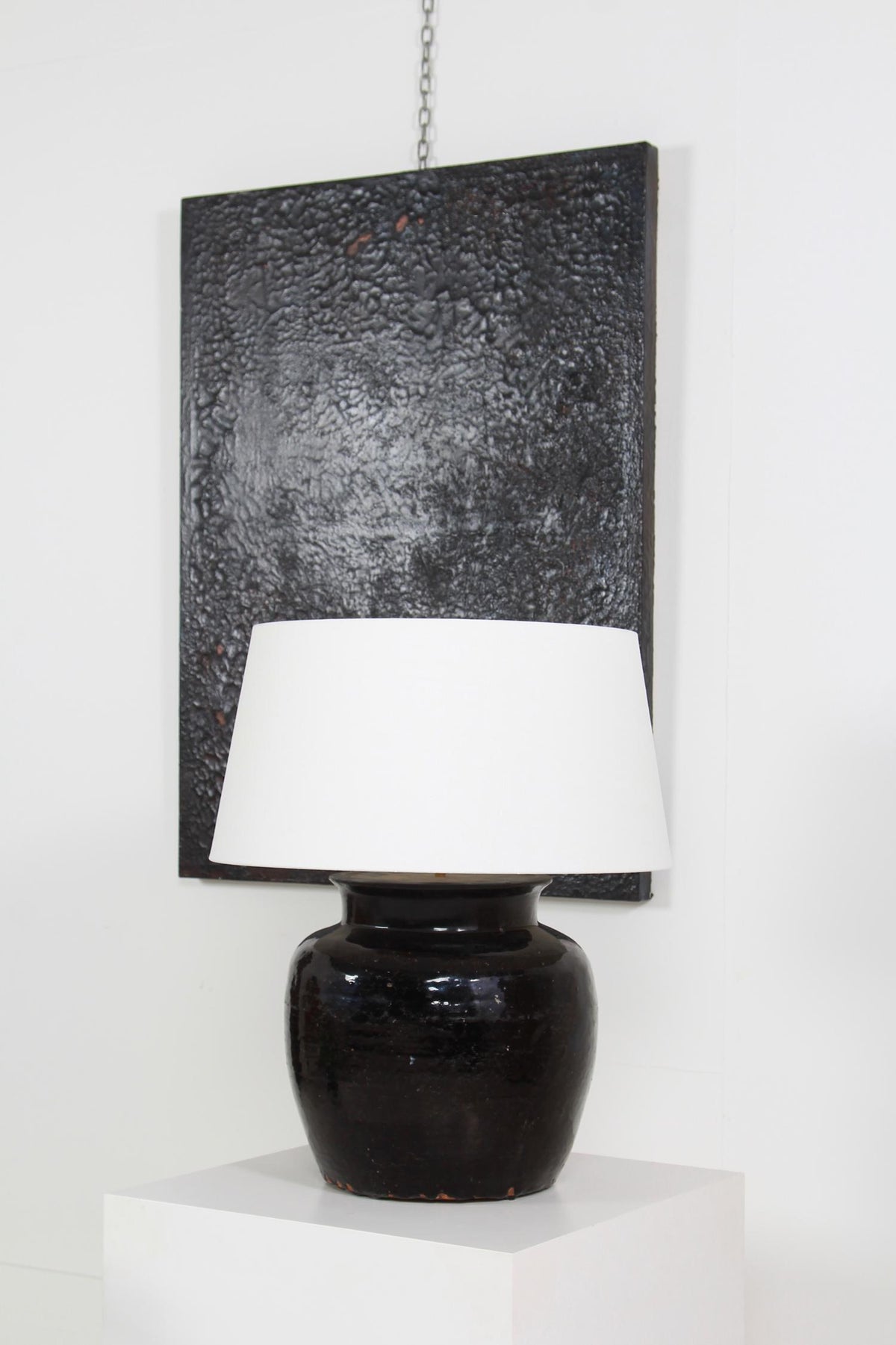 MONUMENTAL ANTIQUE BLACK GLAZED POTTERY LAMP WITH WHITE LINEN SHADE