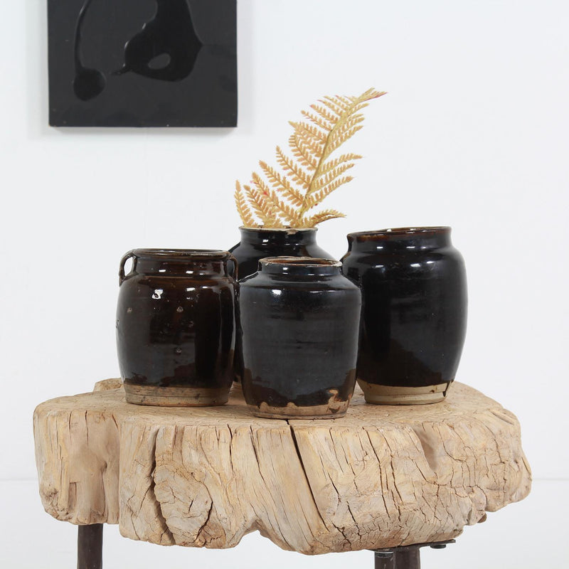 COLLECTION OF FOUR  HANDMADE CHINESE BLACK GLAZED POTTERY JARS