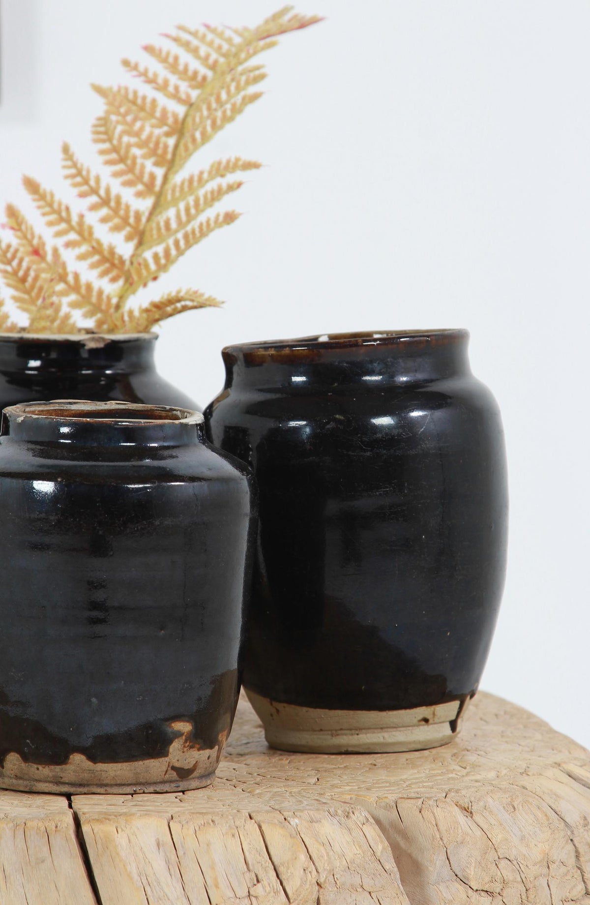 COLLECTION OF FOUR  HANDMADE CHINESE BLACK GLAZED POTTERY JARS