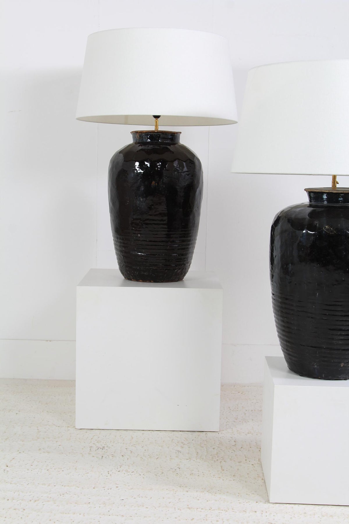 Monumental  ANTIQUE BLACK GLAZED POTTERY LAMPS WITH WHITE DRUM LINEN SHADES