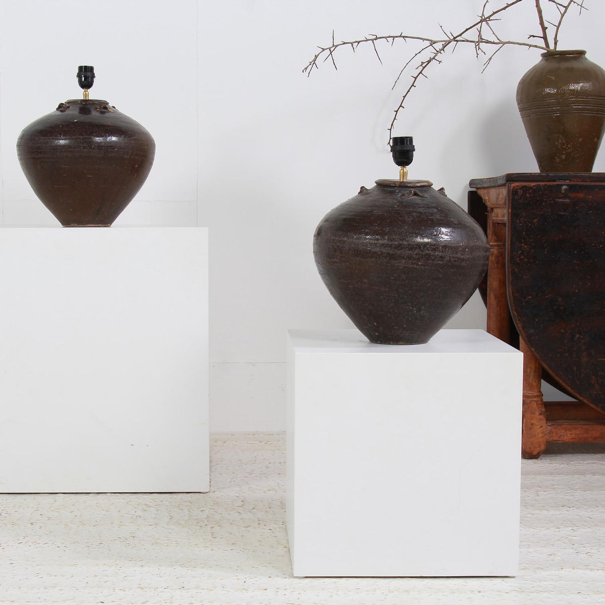 ANTIQUE CHINESE CERAMIC WINE POTS CONVERTED INTO LAMPS WITH WHITE LINEN SHADE