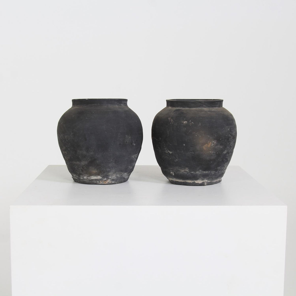COLLECTION OF TWO CHINESE WABI-SABI BLACK POTTERY JARS