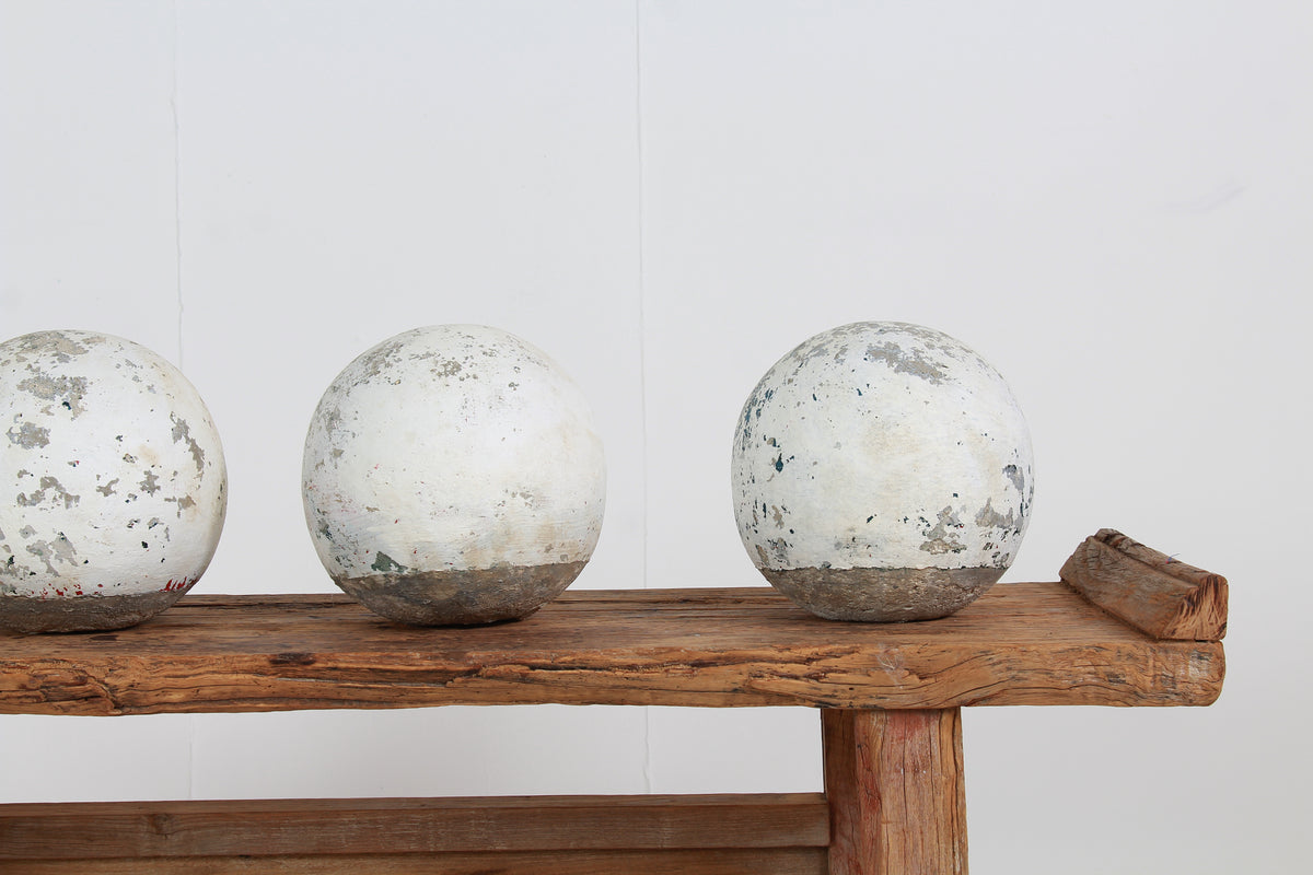 Fabulous Collection of Four French Cast Stone Balls with Old White Paint