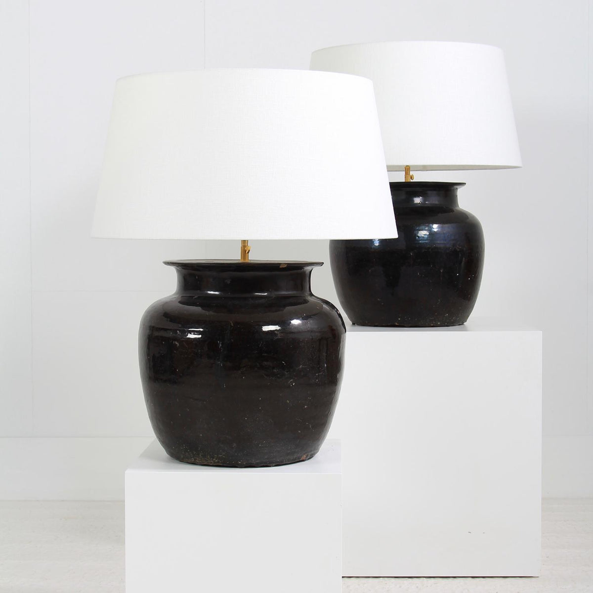 Monumental Antique Black Glazed  Pottery Lamps with White Linen Shades
