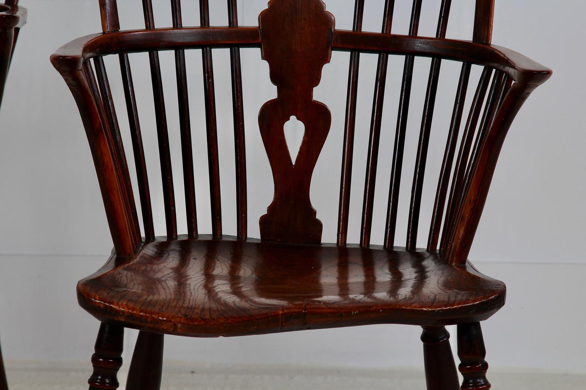 An Exceptionally Fine Pair of Yew Wood Wheel Back Windsor chairs