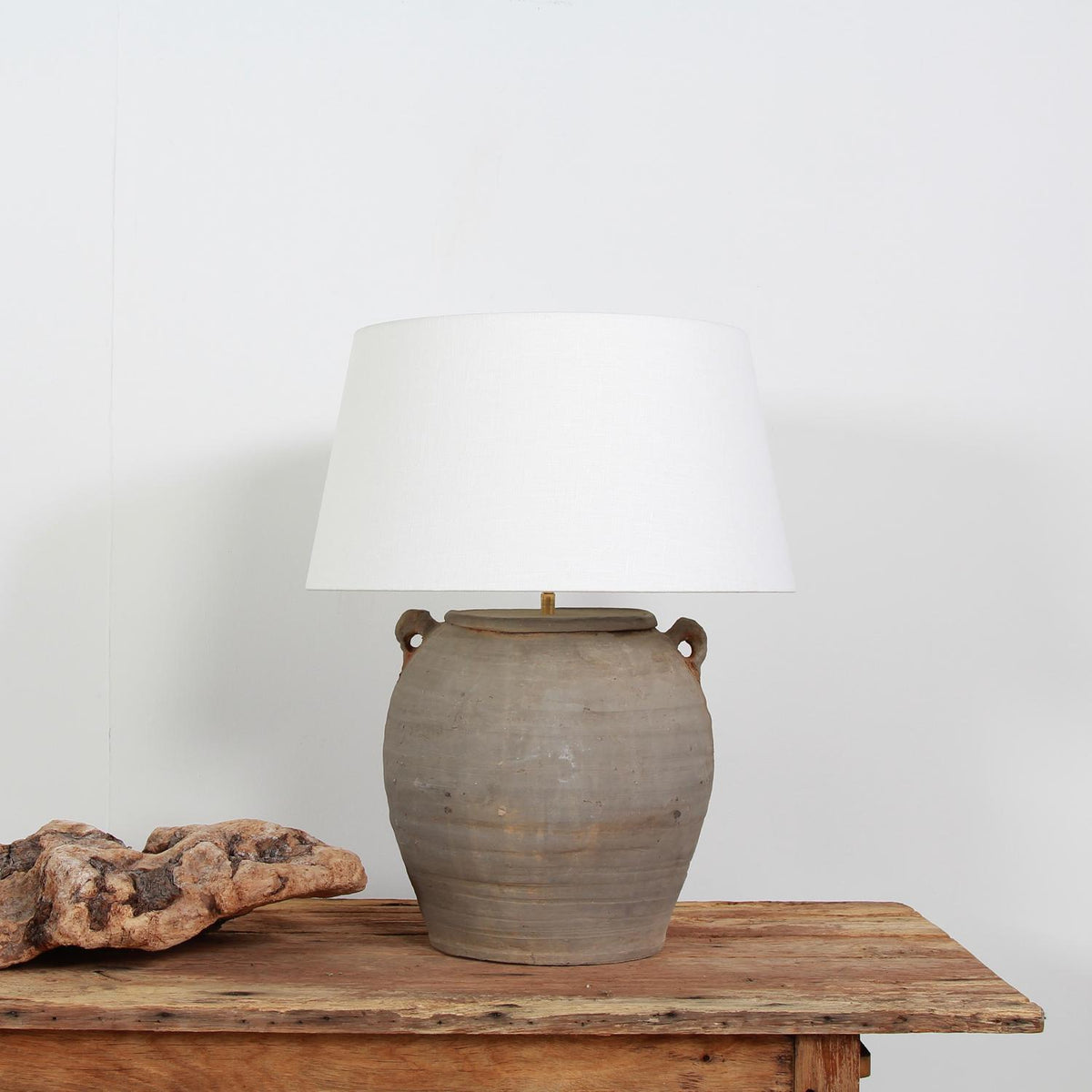 TERRACOTTA UNGLAZED POTTERY LAMP WITH NATURAL LINEN DRUM SHADE