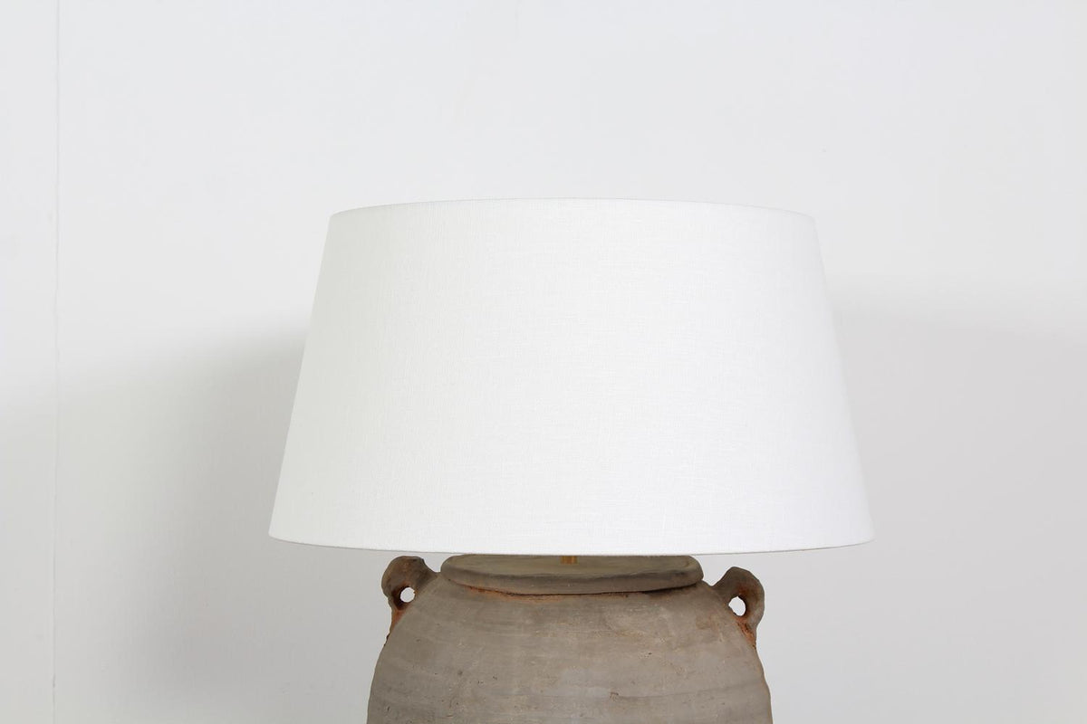 TERRACOTTA UNGLAZED POTTERY LAMP WITH NATURAL LINEN DRUM SHADE