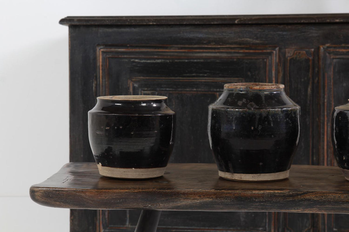 COLLECTION OF Four HANDMADE CHINESE BLACK GLAZED POTTERY JARS