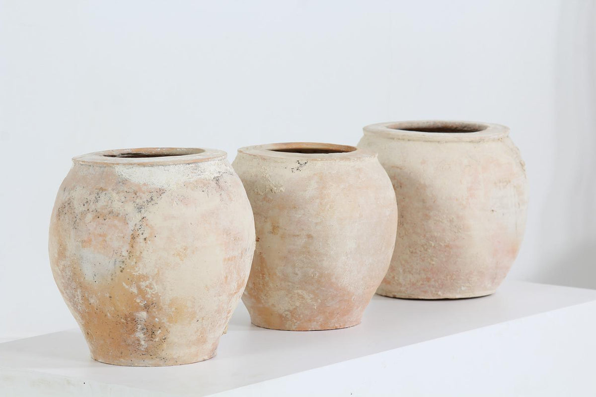 Collection of three terracotta Mediterranean storage jars