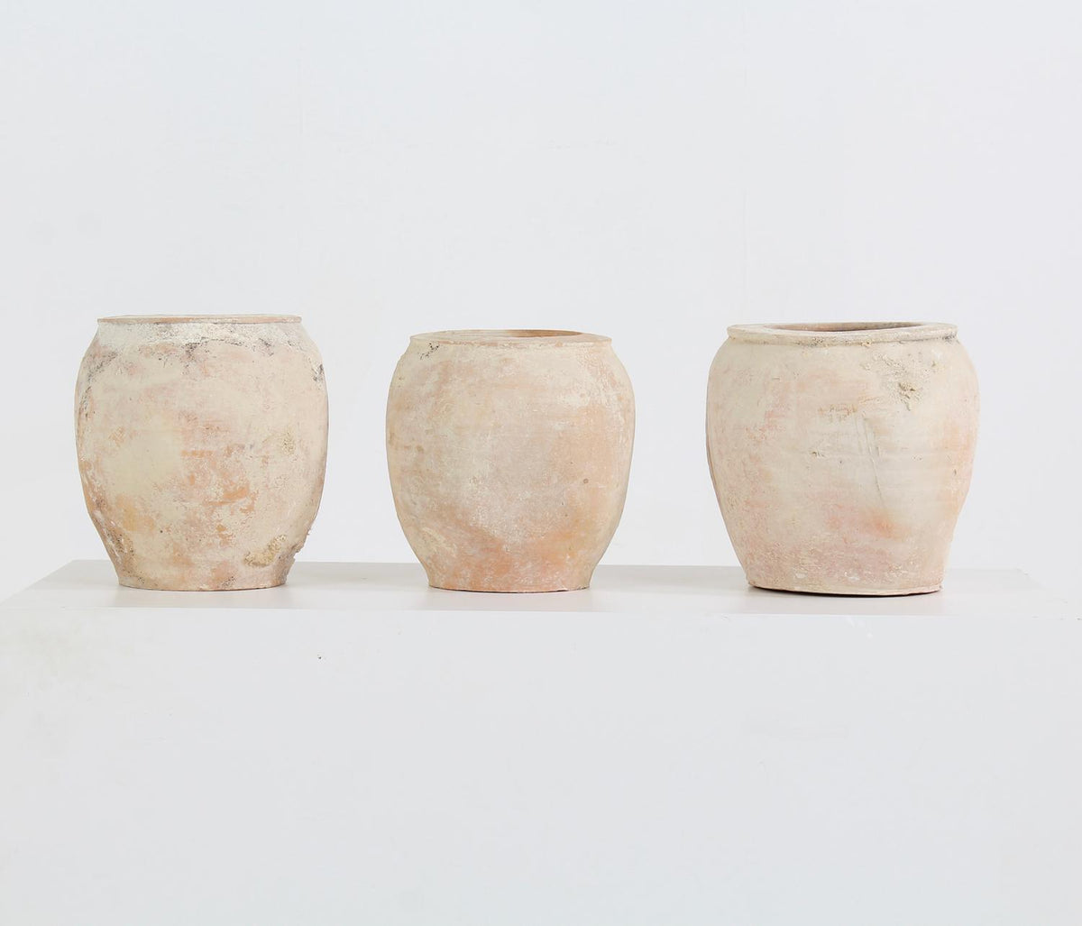 Collection of three terracotta Mediterranean storage jars
